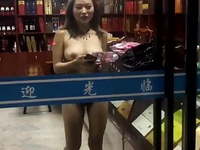 asian exhibitionist nude in shop