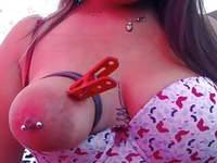 One tied tit with clamps on Latina 